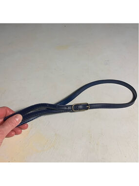 Thin blue belt with gold buckle